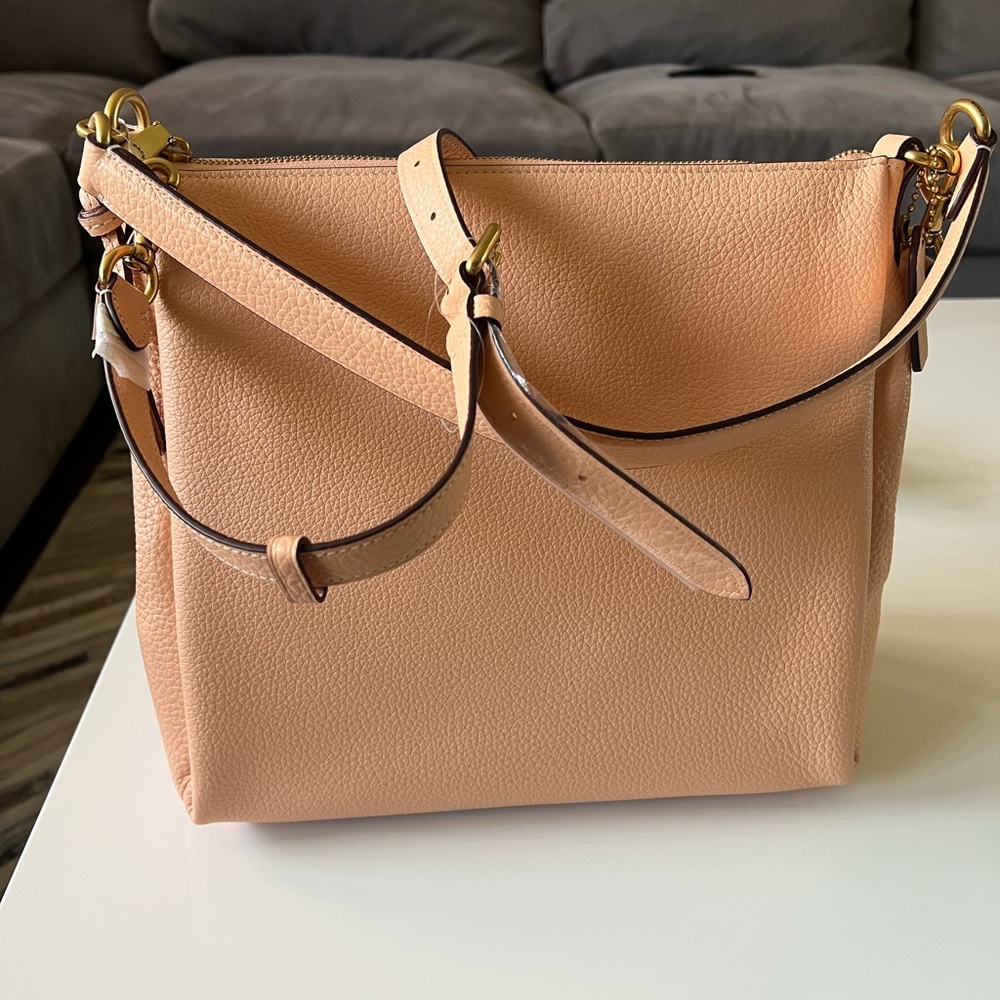 Coach crossbody purse. Coral color. New with tag. Comes with dust bag.